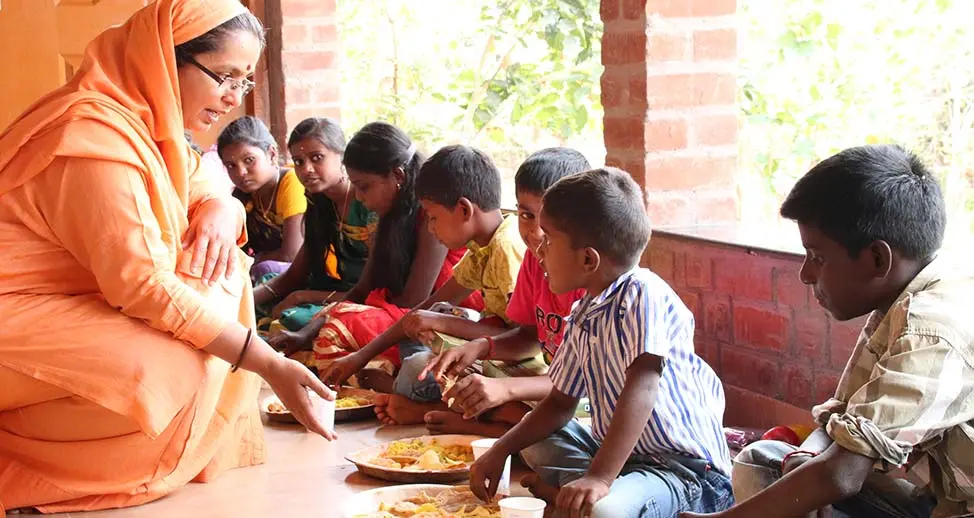 Ammaji, promoting Purna Vidya's message of service